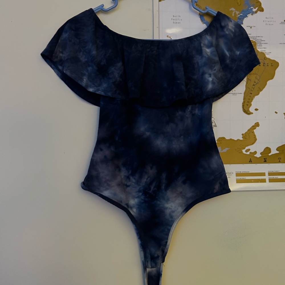 Blue and white tie dye of the shoulder body suit